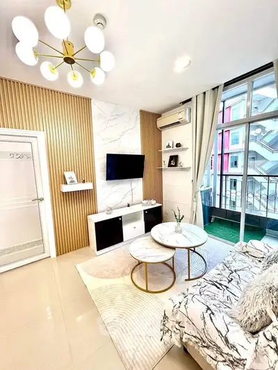 Modern living room with stylish decor and balcony view