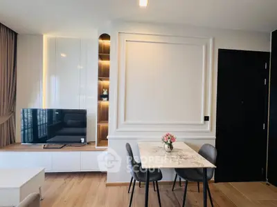 Modern living room with stylish decor and TV unit, perfect for cozy gatherings.