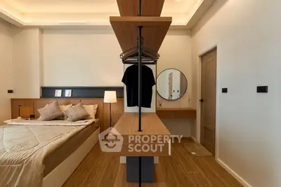 Modern bedroom with stylish wooden furniture and cozy lighting