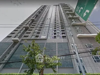 Modern high-rise condominium building with sleek design and urban appeal.