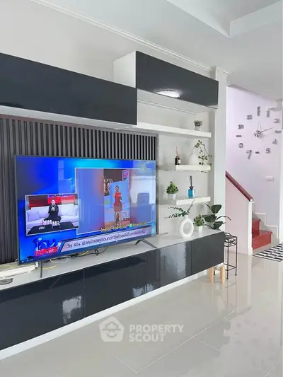 Modern living room with sleek TV unit and stylish decor