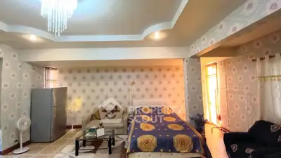 Spacious bedroom with elegant decor and modern amenities
