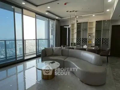 Luxurious modern living room with panoramic city view and elegant furniture.