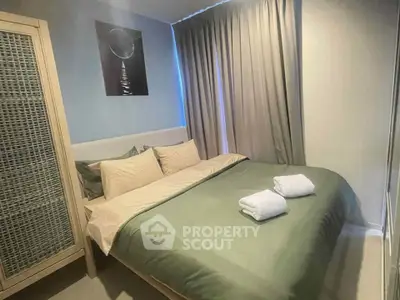 Cozy bedroom with modern decor and soft lighting, perfect for relaxation.