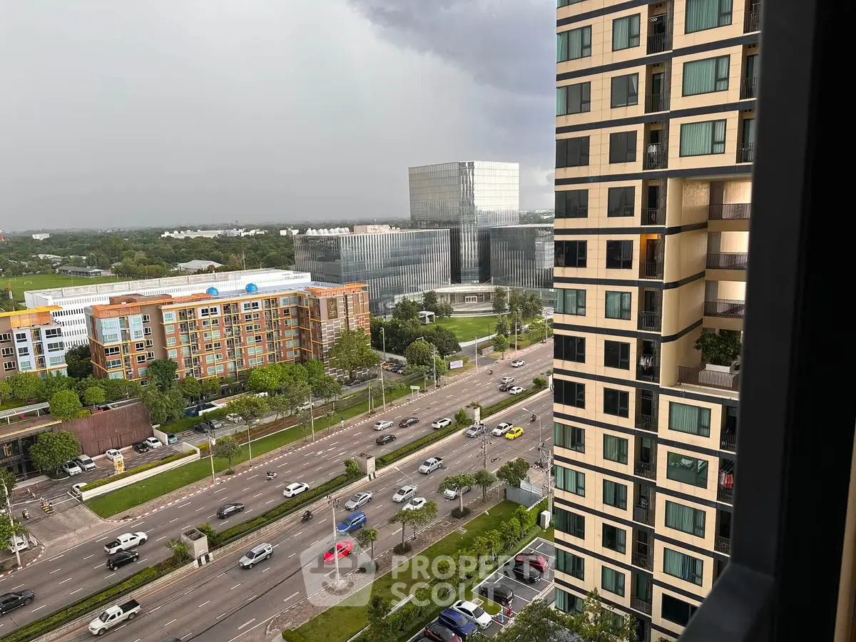 Stunning urban view from high-rise apartment showcasing modern architecture and bustling city life.