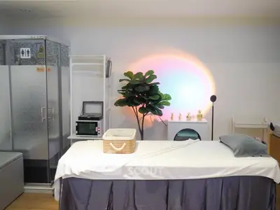Modern wellness room with massage table and ambient lighting