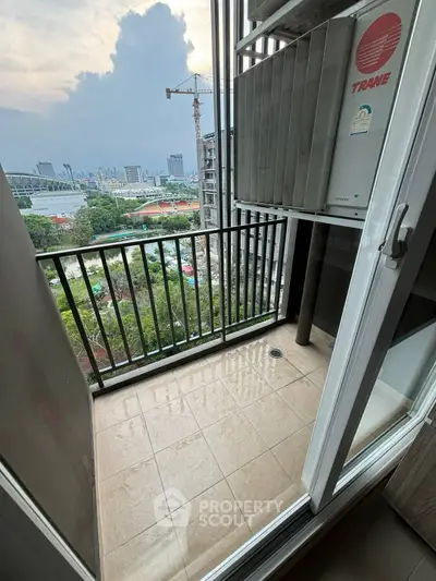 Cozy balcony with city view, perfect for relaxation and enjoying urban skyline.