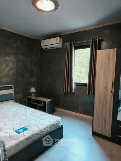 Modern bedroom with stylish decor and natural light