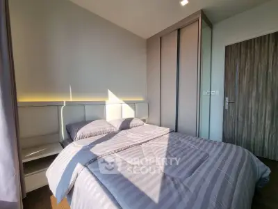 Modern bedroom with stylish decor and ample natural light
