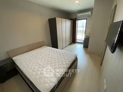 Modern bedroom with sleek design and ample natural light