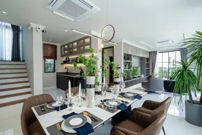 Luxurious open-plan living and dining area with modern kitchen and elegant decor