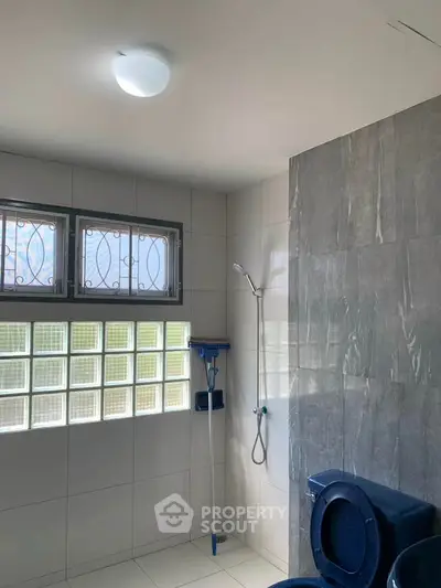 Modern bathroom with sleek shower and natural light