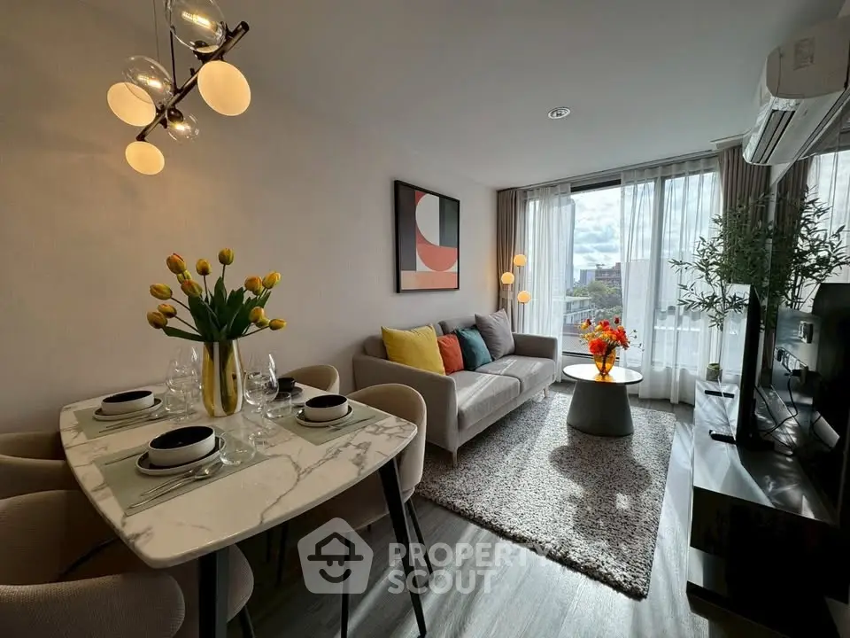 Stylish modern living room with elegant dining area and natural light