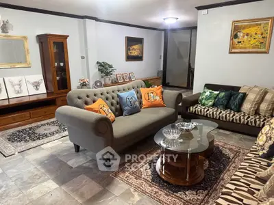 Charming living room with elegant furniture and stylish decor, perfect for cozy gatherings.