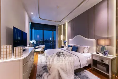 Luxurious bedroom with stunning city view, elegant decor, and ambient lighting for ultimate comfort.
