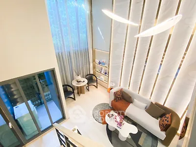 Luxurious modern living room with high ceilings and elegant decor