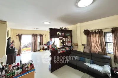 Spacious living room with cozy seating and ample natural light