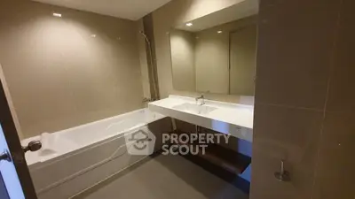 Modern bathroom with sleek design and bathtub in contemporary apartment