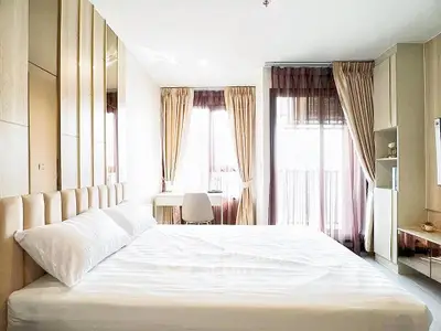 Bright and modern bedroom with large windows and elegant decor