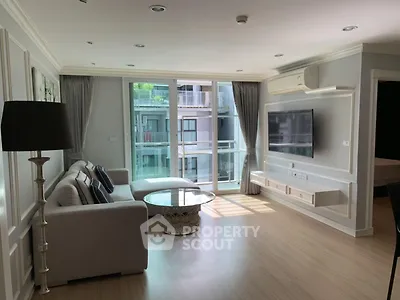 Spacious modern living room with large windows and elegant decor