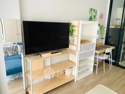 Modern living room with sleek TV stand and cozy workspace