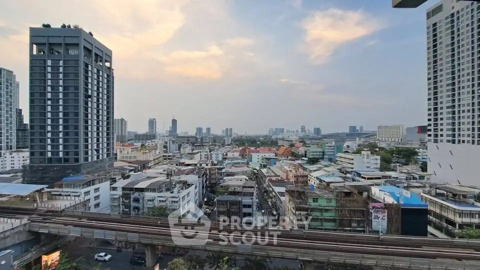 Stunning cityscape view from high-rise building balcony at sunset
