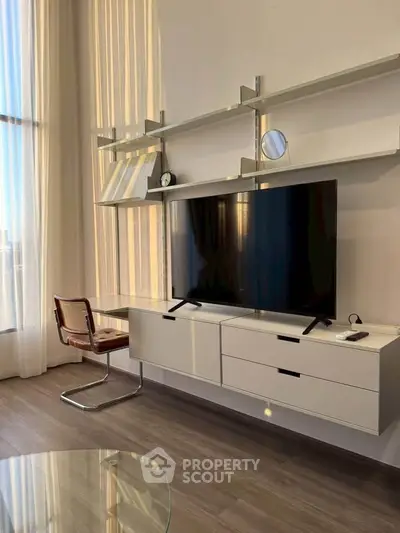 Modern living room with sleek TV unit and stylish shelving