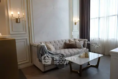 Luxurious living room with elegant decor and plush sofa