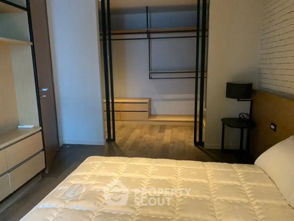 Spacious bedroom with modern walk-in closet and stylish decor