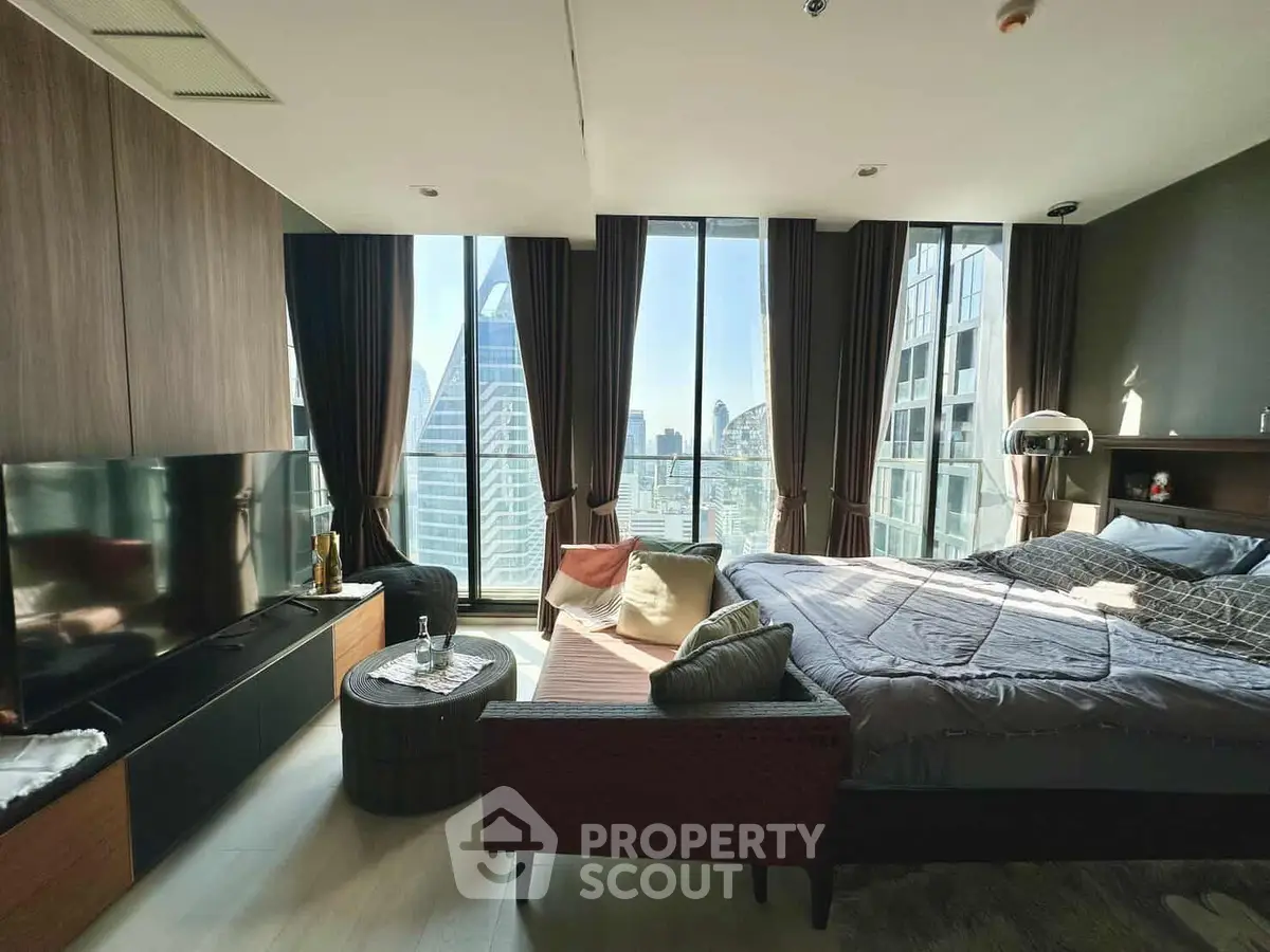 Luxurious modern bedroom with panoramic city view and stylish decor