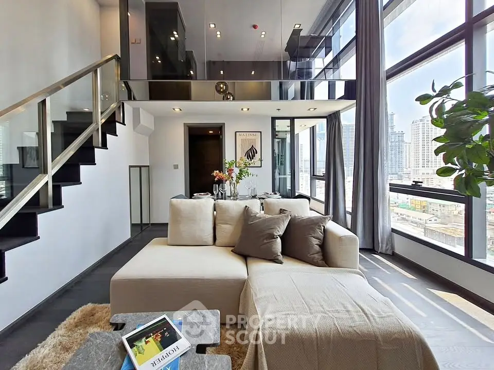 Luxurious modern living room with mezzanine and city view, featuring elegant decor and large windows.