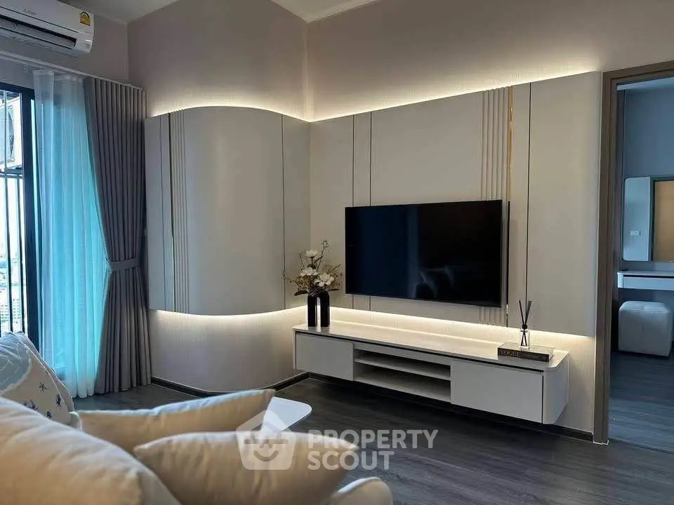 Modern living room with sleek TV setup and elegant lighting