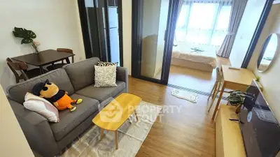 Modern apartment with cozy living room and bedroom, featuring stylish decor and natural light.