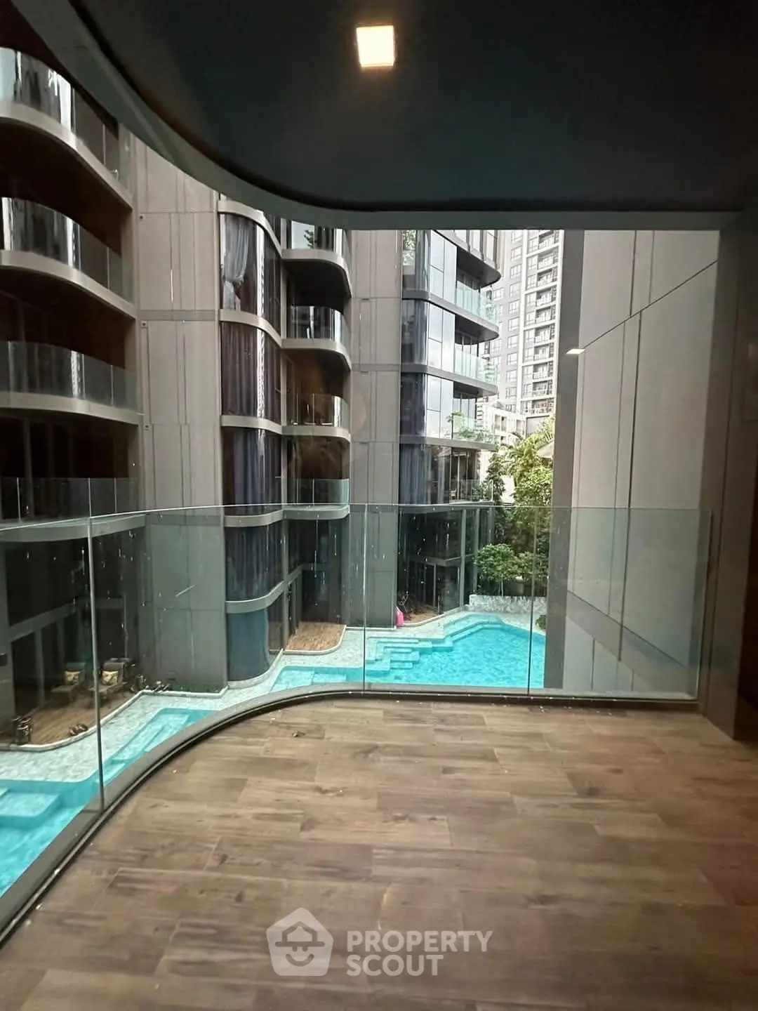 Luxurious condo with stunning pool view and modern architecture
