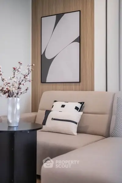 Stylish modern living room with elegant decor and cozy seating area.