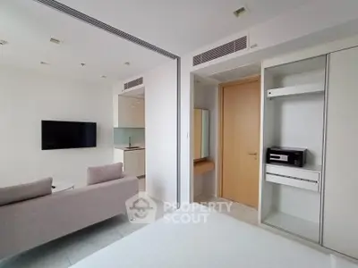 Modern studio apartment with sleek design and built-in storage