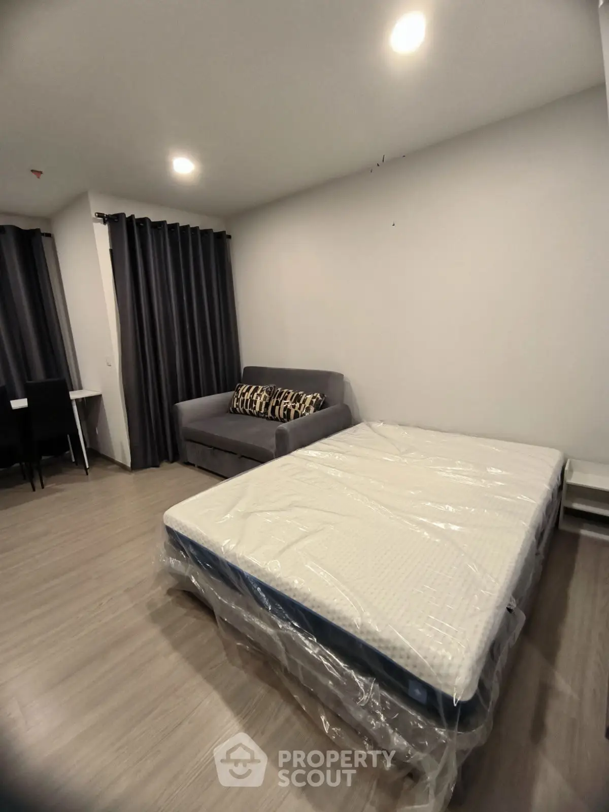 Modern bedroom with cozy sofa and sleek design