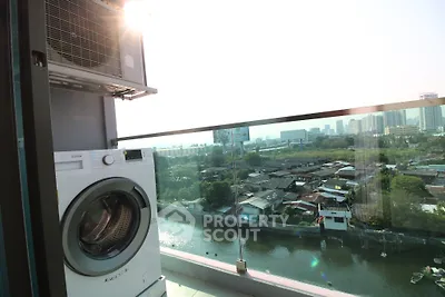 Modern balcony with washing machine and stunning city view over river