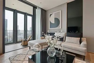 Modern living room with elegant decor and balcony view in luxury apartment.