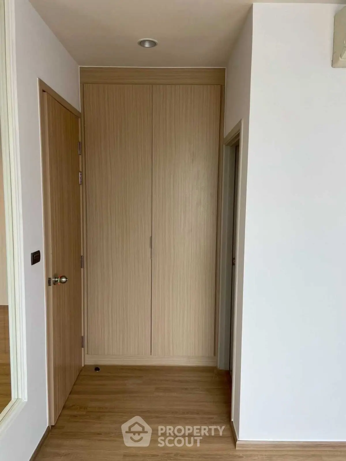 Modern interior hallway with wooden doors and sleek design