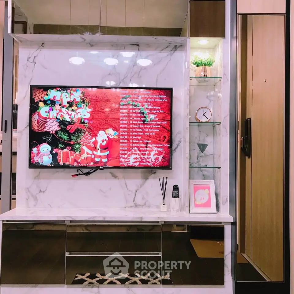 Stylish living room with marble TV wall and festive decor