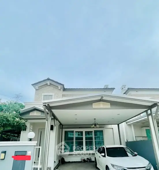 Modern two-story house with carport and parked car in suburban neighborhood.