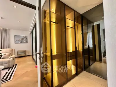 Luxurious modern interior with glass cabinets and cozy living area