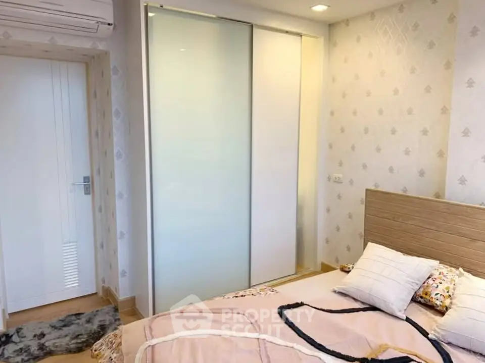 Cozy bedroom with modern sliding wardrobe and stylish decor