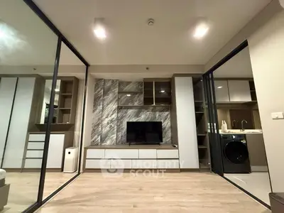 Modern living room with sleek design and integrated appliances