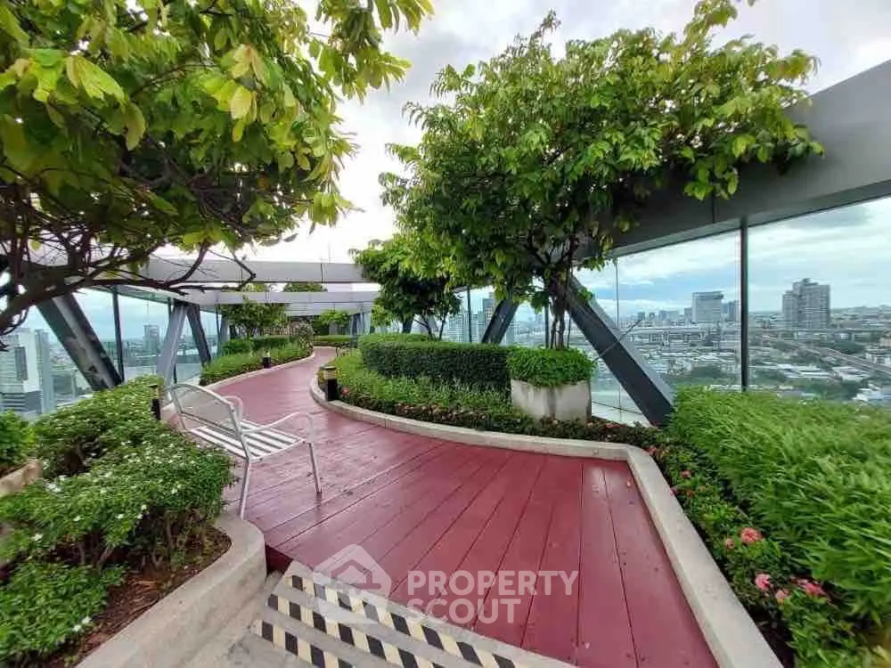 Stunning rooftop garden with panoramic city views and lush greenery.