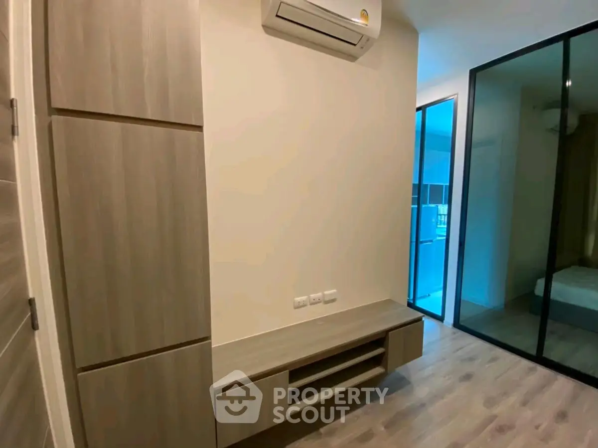 Modern bedroom with built-in storage and air conditioning