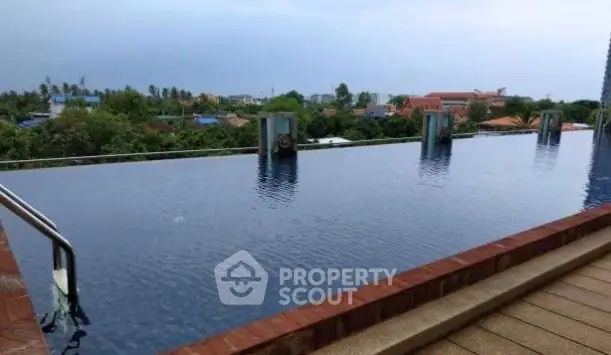 Luxurious rooftop infinity pool with stunning panoramic views of the city skyline.
