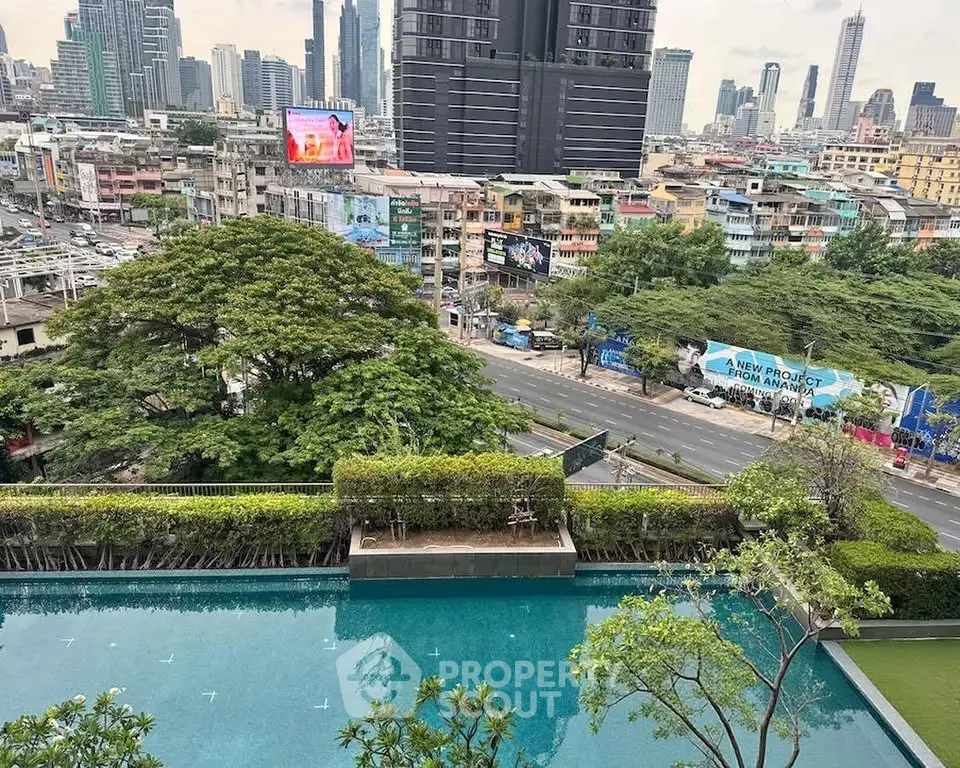 Stunning cityscape view from a luxurious rooftop pool in a vibrant urban setting.