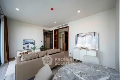 Modern living room with elegant furniture and open layout in a stylish apartment.